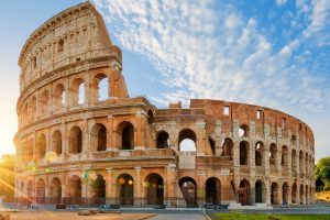 Colosseum in Rome and morning sun, Italy