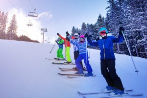 Group ski sports kids portrait on mountain slope