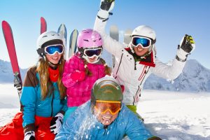 Ski, snow, sun and winter fun - happy family ski team