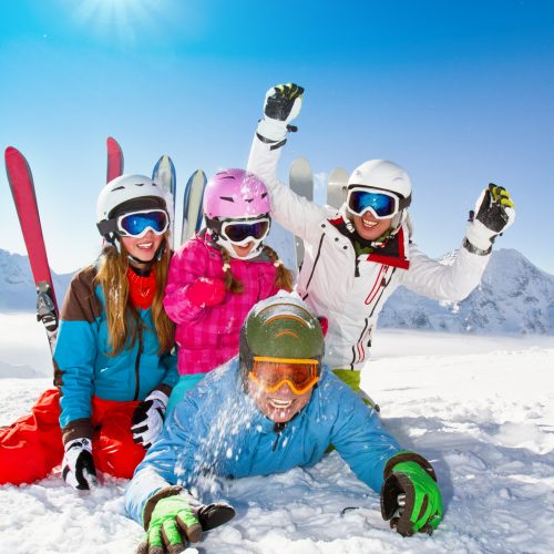 Ski, snow, sun and winter fun - happy family ski team
