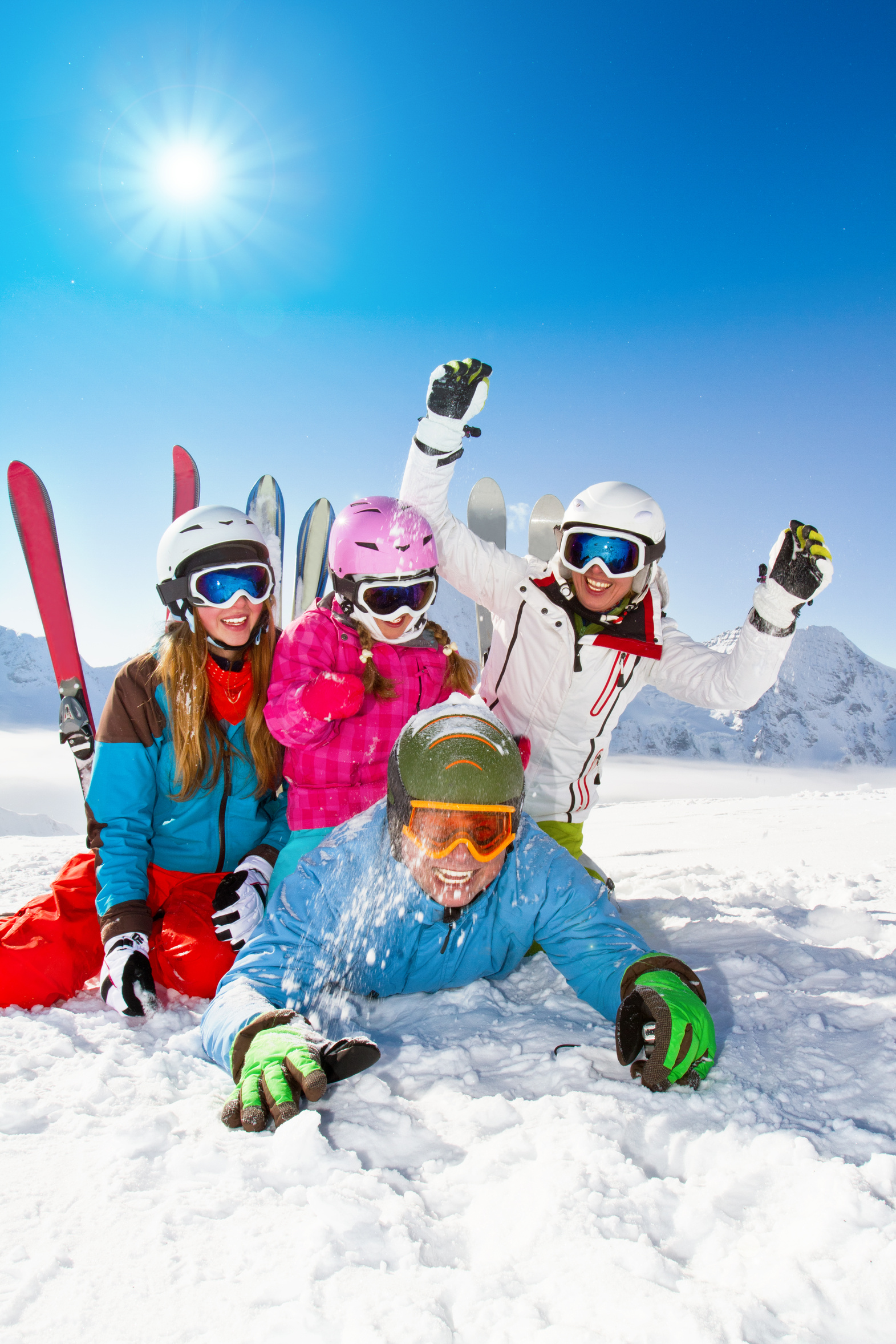 Ski, snow, sun and winter fun - happy family ski team